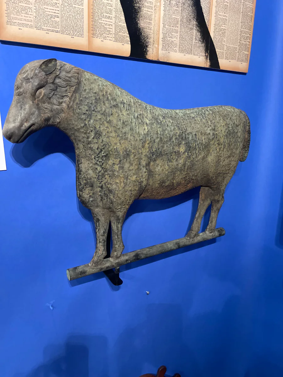 Aged copper sheep weathervane with natural patina, representing American folk art